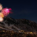 fireworks display from snow capped mountain during nighttime