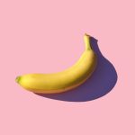 riped banana on pink surface